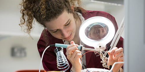 Engineering maths student soldering