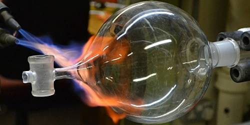 Close up of a glass bottle being made